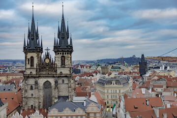 Obraz premium Aerial view of Prague skyline with orange tiled rooftops, Czech Republic