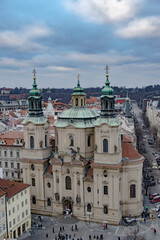 Obraz premium Aerial view of Prague skyline with orange tiled rooftops, Czech Republic