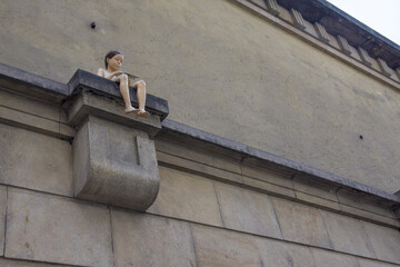 Symbol of Prague, a girl sitting on a wall