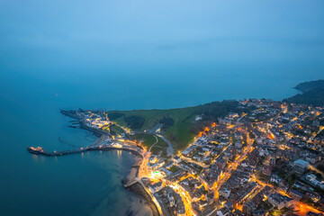 Aerial night view of the famous travel destination, Swanage, Dorset, South West England. blue hour winter