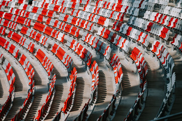 Empty red and grey seats at modern stadium