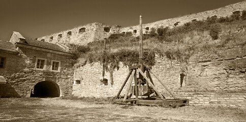 Kamyanets-Podilsky citadel tourism museum, Ukraine. 12 may 2023. Old wooden catapult in the...