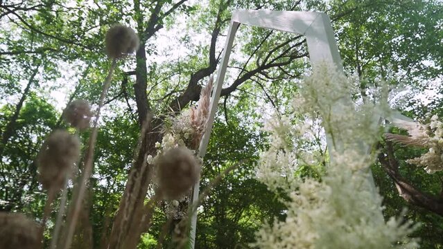 Boho wedding arch on the forest. Wedding decor created by a talanted florist 