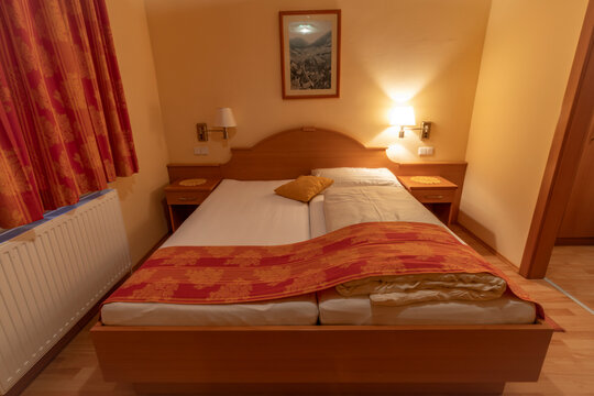Clean Alpine hotel room with bed and table in Schottwien Austria 01 13 2024