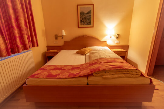 Clean Alpine hotel room with bed and table in Schottwien Austria 01 13 2024