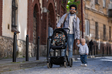 Young hindu man having a walk with kid