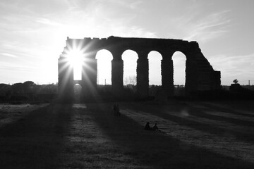 roman aqueduct at sunset