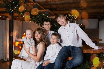 family Christmas photo. large family at the New Year tree. family ties