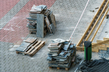 Laying paving slabs on a construction site. Repair of a road or sidewalk. The new paving slabs are...