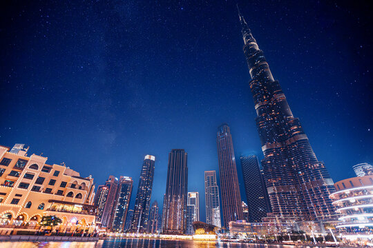Night cityscape of center Dubai skyscrapers illuminated, Famous tourist landmark of city UAE