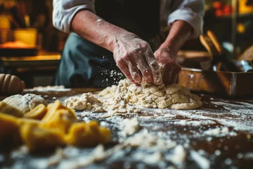 Fotobehang Hands preparing dough with flour on a table, kneading and baking © Mayava