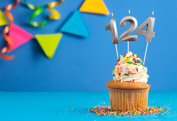 Candle number 124 - Cake birthday in blue background