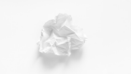 A completely crumpled sheet of paper on a white background close-up. A crumpled discarded sheet of white A4 paper. A white sheet of paper was crumpled into a ball. Paper trash close-up.