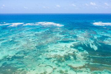 Fototapeta premium Atlantic ocean with reef and azure water. Caribbean nature. Aerial view