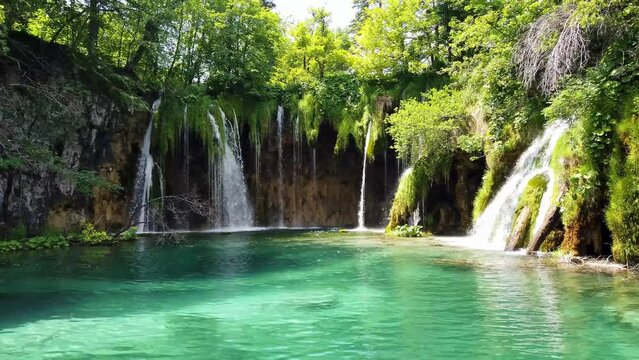 Majestic view on waterfall with turquoise water in the Plitvice Lakes National Park, Croatia. Europe. One of the oldest and largest national parks in Croatia. UNESCO World Heritage