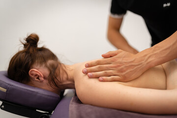 Obraz na płótnie Canvas Concentrated Back Massage by Professional Masseuse