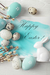 easter greeting card with blue eggs and willow branch decoration - 711890303