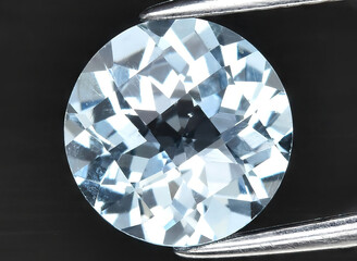 natural blue topaz gem on the background