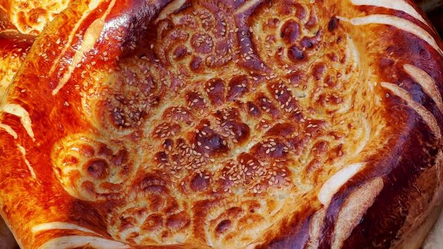 Tortillas on the market in Samarkand, Uzbekistan - June 29, 2023: Goods and traders at the Oriental Bazaar in Uzbekistan. Siab Bazaar is the largest and oldest bazaar in Samarkand. 4K