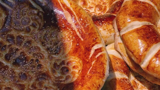 Tortillas on the market in Samarkand, Uzbekistan - June 29, 2023: Goods and traders at the Oriental Bazaar in Uzbekistan. Siab Bazaar is the largest and oldest bazaar in Samarkand. 4K