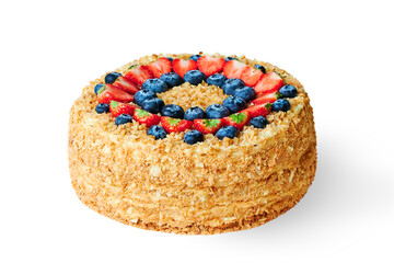 Fototapeta na wymiar Big round Napoleon cake decorated with strawberries and blueberries isolated on white background