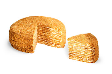 Large piece of honey cake and big round Honey cake isolated on white background