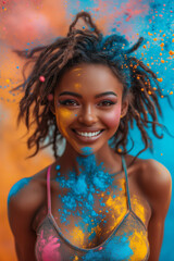 A woman dancing and having fun with colored powder. 
