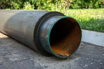 Large metal water pipe covered with polymer foam as thermal insulation material