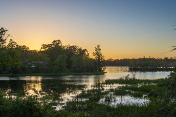 Dog River near Mobile, Alabama, at sunset - obrazy, fototapety, plakaty