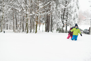 Kids Having Fun at Park Playing in Snow