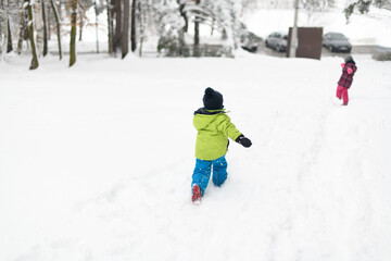 Children Run and Play in the Winter Forest