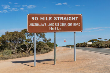90 Mile Straight sign (Australia's longest straight road) at Caiguna Roadhouse, Nullarbor Plain,...