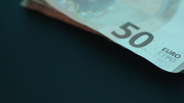 Money and Car Keys are placed on the table. Close-up, shallow dof.