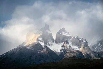 Wall murals Cordillera Paine cuernos del paine in the floating clouds