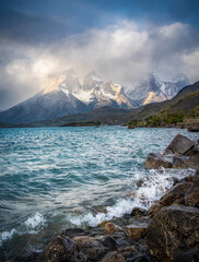 Cuernos del Paine and Lago Pehoé under cloudy sky and  water splash