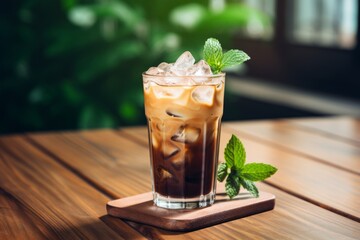 The perfect summer refreshment: A glass of iced vanilla coffee on a rustic table