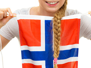 Young woman with norwegian flag