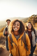 Three happy friends hiking in the mountains