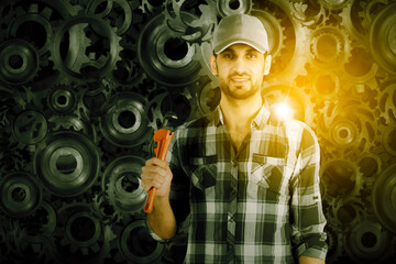 Portrait of handyman with tool over cog wheels background