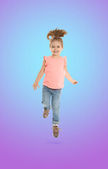 Happy cute girl jumping on color gradient background