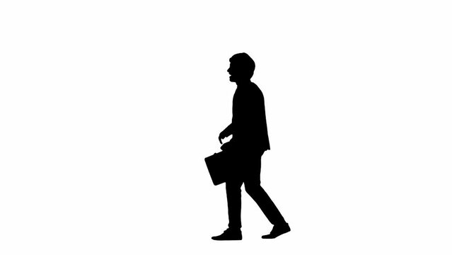 Modern businessman advertising concept. Man in studio isolated on white background with alpha channel. A black silhouette of a businessman in a suit walks and dances with a suitcase in his hands.
