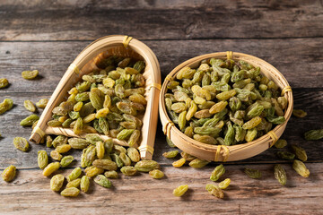 Green Raisin Dried Fruit on wooden table.