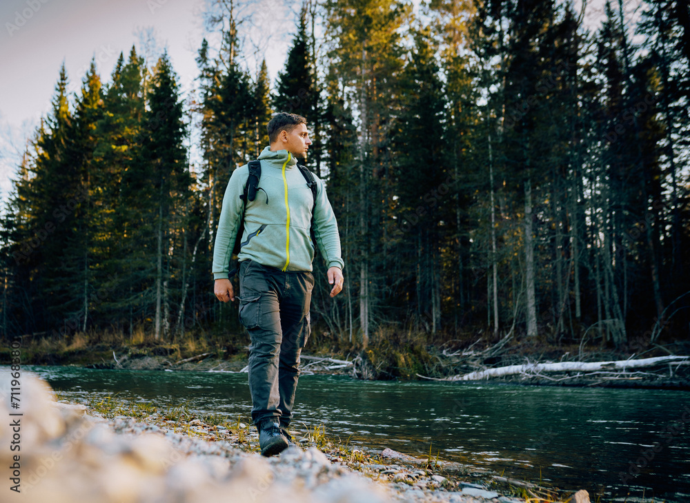 Wall mural person walking in the woods