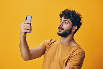 Adult phone men smartphone caucasian white yellow portrait background mobile person attractive...