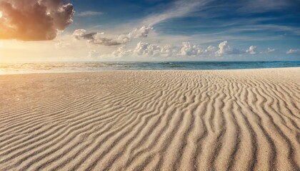 The sunset on the sand texture beach.