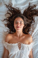 Relaxed serene female laying down on the bed. Happy young woman taking a break time, Resting on the bed and enjoy her weekend at home