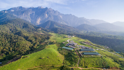 aerial view of Kundasang Sabah landscape and Mount Kinabalu at far background during morning.