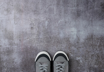Gray background with pair sneakers on gray background