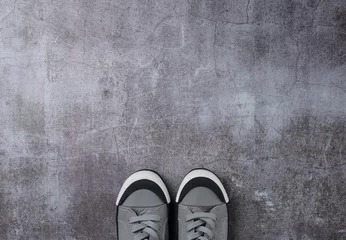 Foto op Canvas Gray background with pair sneakers on gray background © Александра Ним