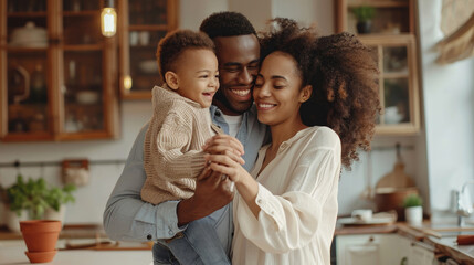 Happy family: full body delighted diverse parents playing and dancing with son in cozy kitchen on weekend day at home - obrazy, fototapety, plakaty
